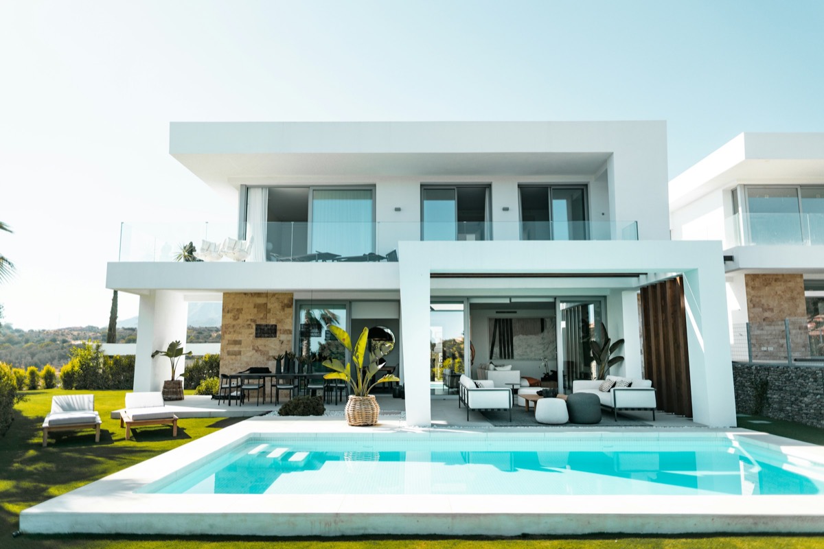 Finished white villa with a private pool and manicured lawn